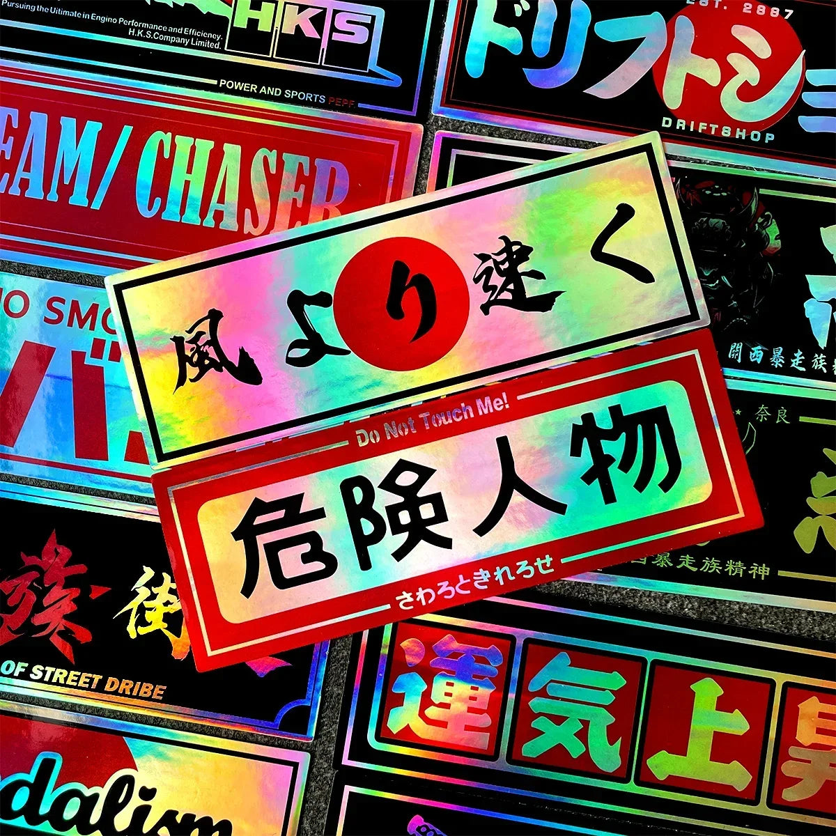 Holographic Japanese car stickers featuring racing and automotive-inspired artwork