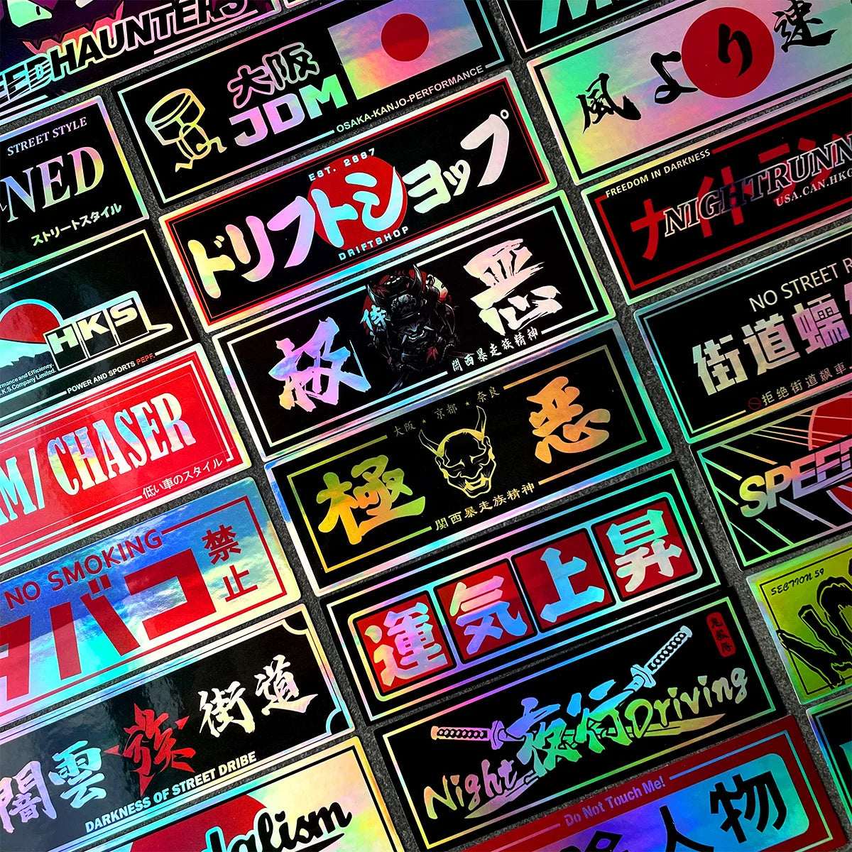Holographic JDM sticker pack featuring drift, tuner, and racing-inspired vinyl decals