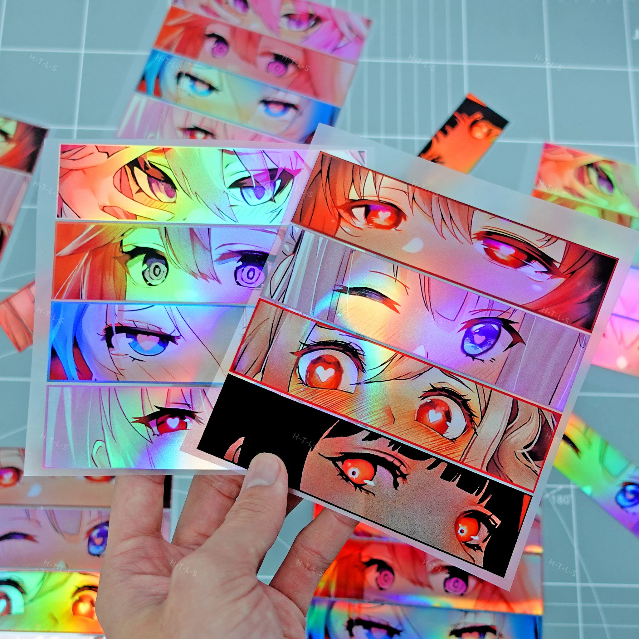 Holographic anime eye stickers featuring colorful manga-inspired artwork
